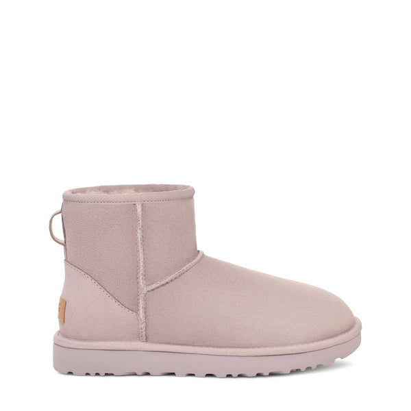 Light pink ankle boot on a white background.