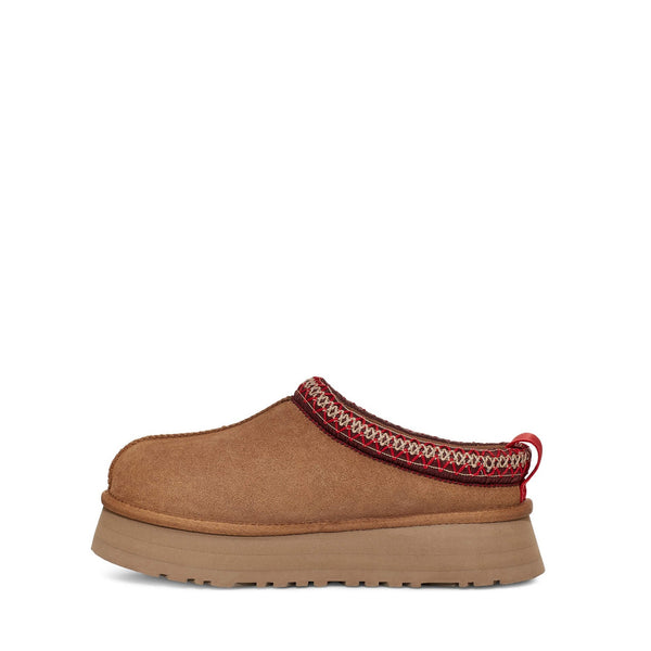 Brown suede slip-on shoe with red stitching and thick rubber sole.