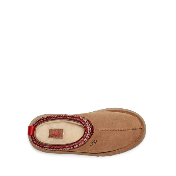 Brown suede slip-on shoe with red stitching and thick rubber sole.