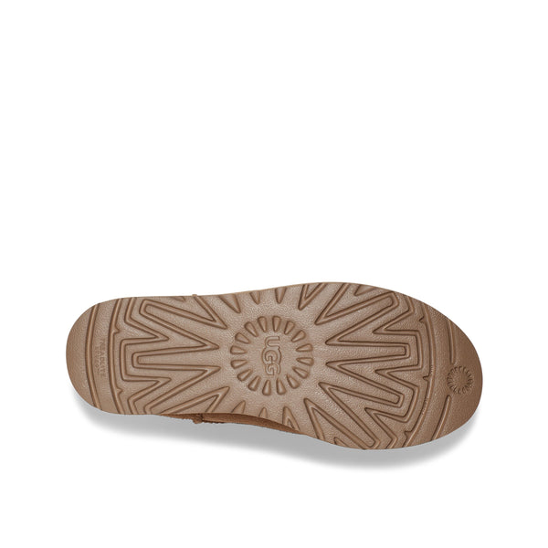 A sole of a shoe with a patterned tread on a white background.