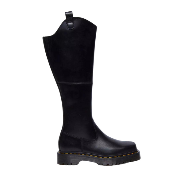 Black knee-high boot with a chunky sole and yellow stitching.