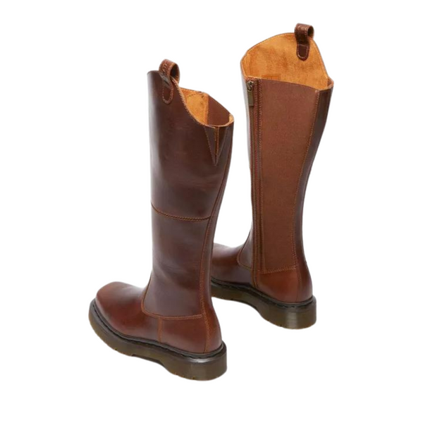 A pair of brown leather riding boots with zippers isolated on a white background.