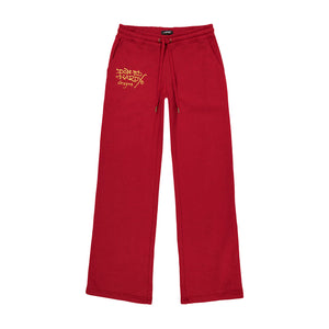 Red sweatpants with drawstrings and a gold logo on the upper left leg.