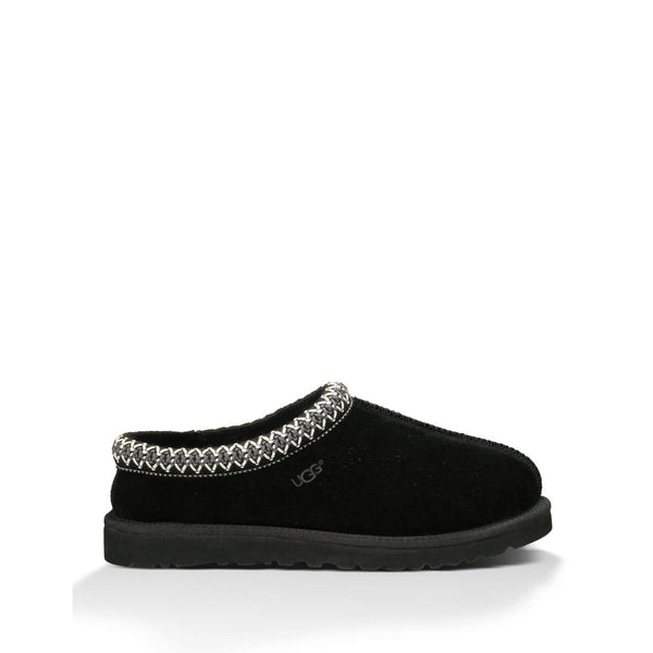 Black UGG slipper with braided trim detail on a white background.