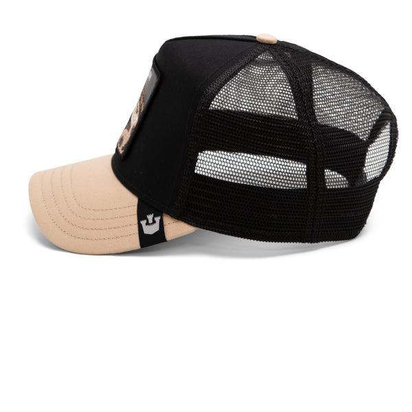 A beige and black mesh-back cap with a visible brand logo on the left side.