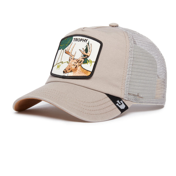 Angled view of a beige trucker hat with embroidered deer and the word "trophy" patch on the front.