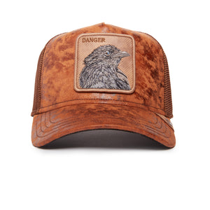 Brown trucker hat with a patch depicting a bird and 