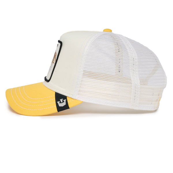 White and yellow baseball cap with embroidered patch reading "PUFF PUFF" featuring a pufferfish.