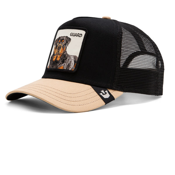 A trucker hat with a patch featuring a Rottweiler labeled "GUARD" on a white background.